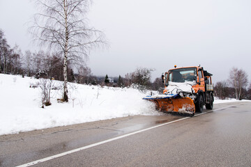 Snowplow removing snow in the street after blizzard