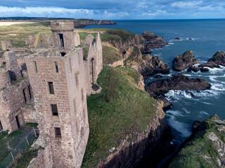 Fototapeta na wymiar Slains Castle, Scotland is linked with Dracula and with the Bram Stoker, who was to Cruden Bay and his novels,The Watter's Mou' and The Mystery of the Sea, Kyllion Castle in The Jewel of Seven Stars