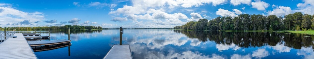 Fototapeta na wymiar Panorama of Henderson Lake from Wallace Brooks Park boat dock - Inverness, Florida, USA