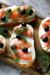 Sandwiches with salmon and olives.