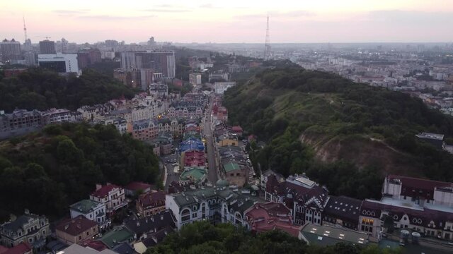 View of Andreevsky descent and Vozdvizhenka in Kyiv between dark green mountains