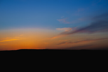 Sunset in the forest in autumn.