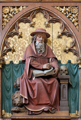 Obraz premium VIENNA, AUSTIRA - JUNI 24, 2021: The relief of St. Jerome the doctor of west church in the church Marienkirche by unknown artist from end of 19. cent.