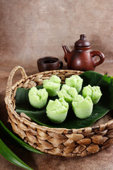 Kue Mangkok pandan or Kue Apem, Indonesian traditional steamed cupcake tinted with pandan paste