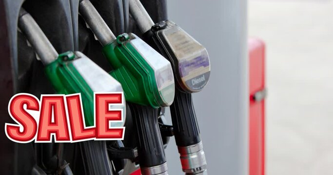 Animation of sale text in red over row of fuel pumps at petrol station