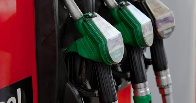 Row of three fuel pumps in stand at petrol station