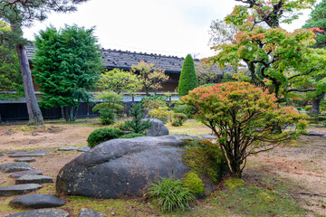 Traditional Japanese garden in Takayama Jinya in Gifu, Japan in autumn
