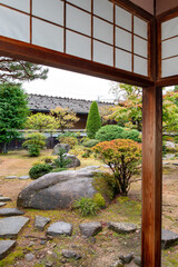Traditional Japanese garden in Takayama Jinya in Gifu, Japan in autumn