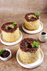 Mini banana chiffon cake with chocolate sauce.