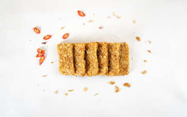 tempe, traditional Indonesian food served as fried food. sliced fried tempe on a white background...