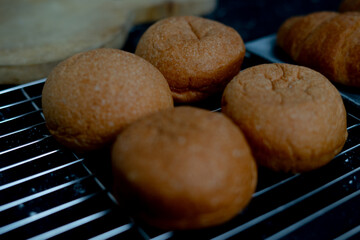 the close up look of four pieces of bread on the cooling net. a shoot for photo presentation or advertisement.