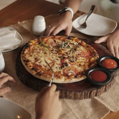 person holding pizza