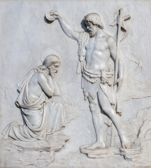 ROME, ITALY - AUGUST 28, 2021: The marble relief of Baptism of Christ in the church Sant Giagomo in Augusta by Antonio Piazza 1926.