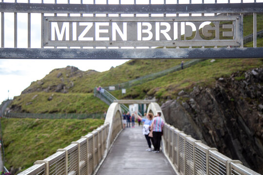 Tourists taking a selfie on Mizen Head Bridge, County Cork, Ireland