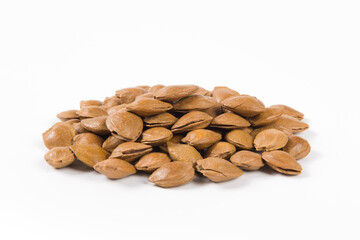 unpeeled almonds isolated on white background