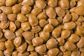 unpeeled almonds texture background