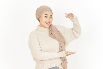 Presenting and Holding Big Product of Beautiful Asian Woman Wearing Hijab Isolated On White Background