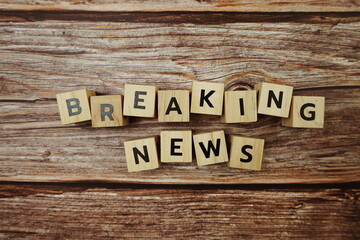 Breaking News Word alphabet letters on wooden background
