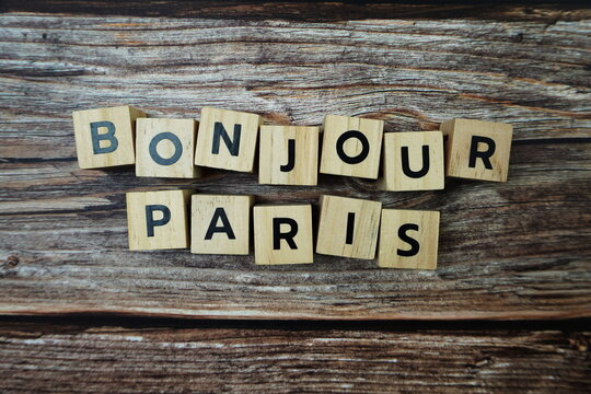 Bonjour Paris Word alphabet letters on wooden background