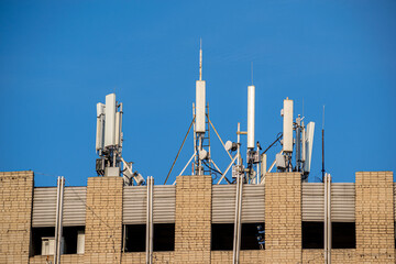 Cellular towers on the roof of the house. Antennas and repeaters for satellite communications