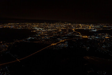 view of the night city from the airplane window