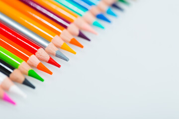 colored pencils isolated on white background, close-up, selective focus