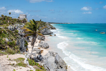 Caribbean sea view on the beach from above with the palm in Tulum, sandy beach and blue water