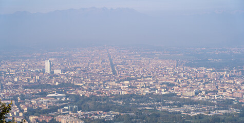 Torino, Italy. Amazing view of the city from the Superga hill. Morning panorama. Haze and pollution covering the city