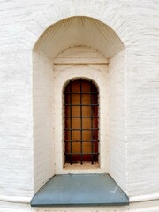 Antique window with metal bars