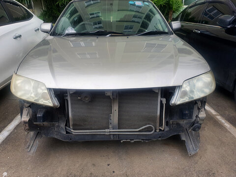 BANGKOK, THAILAND - October 05, 2021 : Car crashed from the accident on the road. Parked on the side of the road beside the sidewalk.