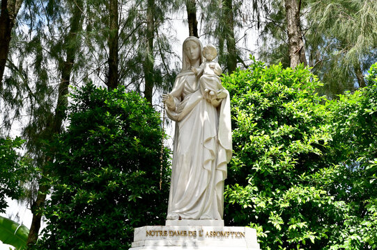 Statue of Our lady and child Jesus catholic church with natural background. at thailand