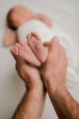 small babt feets in parents hand