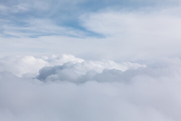 Naklejka premium Flying in the white clouds . Cloudscape view