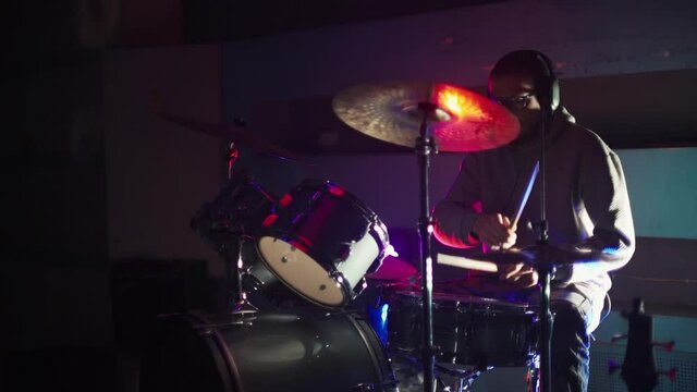 Drummer playing drums in the club