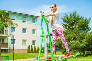 Girl exercise at outdoor gym area