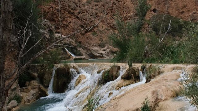 Pan Down shot of a waterfall in Chorreras del Cabriel in Cuenca, Spain