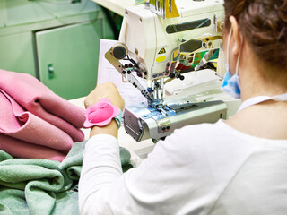 Tailor at work with sewing machine