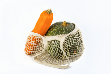 Fresh vegetables pumpkin and squash in a reusable grid, the concept of zero waste without plastic