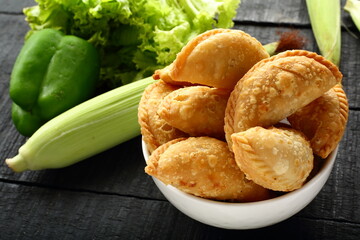 Indian street foods- chicken curry puffs, samosa.