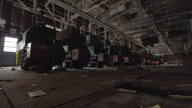 Slider Footage of Industrial Machines in an Decaying, Abandoned Factory.  Dusty, Dirty, Haunted.