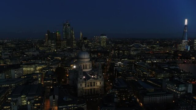 Aerial View Pulling Back From St Pauls Cathedral Showing The City In The Background.