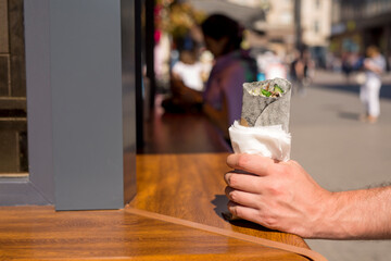Shawarma in a man's hand