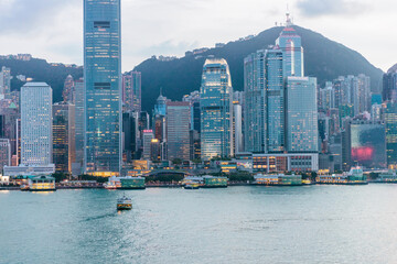 Fototapeta premium Colorful evening of the famous tourist location, Victoria Harbour, Hong Kong