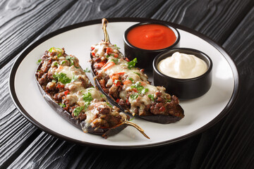 traditional Spanish stuffed eggplant berenjenas rellenas close-up in a plate on the table. Horizontal