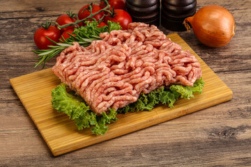 Raw pork minced meat over board