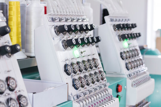 Embroidery machines, textile industry. Hat factory.