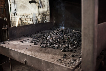 Image of heap of hot coal in the furnace at the factory