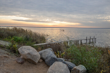 Colorful sunrise on the shores of Lake Nero. Autumn landscape with a lake in the early morning. A...