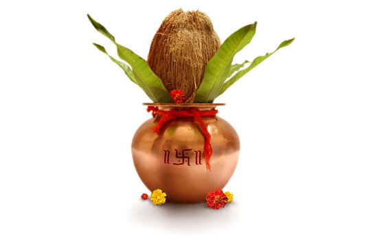 Indian festival akshaya tritiya, Wedding concept : Decorative Copper kalash with coconut and mango leaf with floral decoration on a white background. Essential in Hindu Puja.