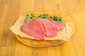 Raw salted tuna slice over board